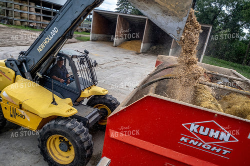 Farmers Loading Feed Mixer 250194