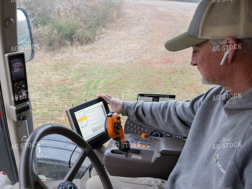 Farmer Using Sprayer Monitor 79556