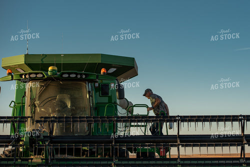 Farmer Climbing into Combine 274035