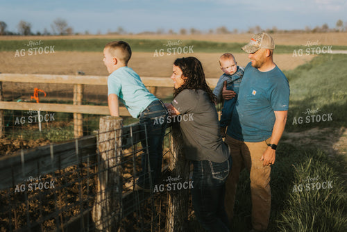 Farm Family Standing at Fence 7414