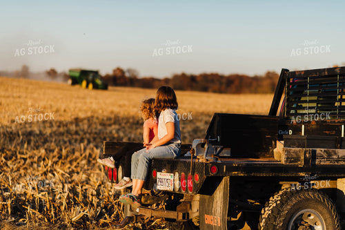 Farm Kids Sitting on Back of Truck 115047