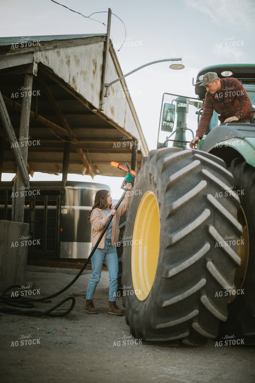 Farmer Fueling Tractor 6840