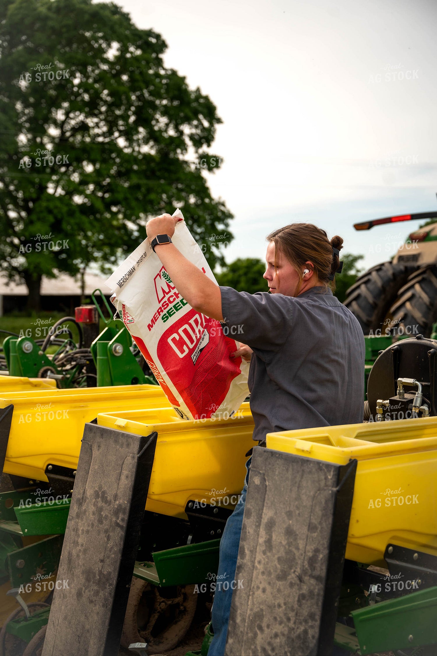 Female Farmer Filling Planter 115628
