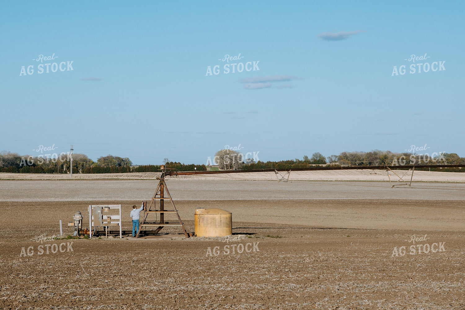 Farmer Working on Irrigation Control Panel 77247