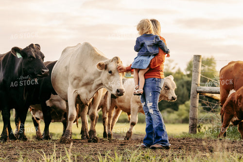Farm Mom and Kid with Cattle 68242