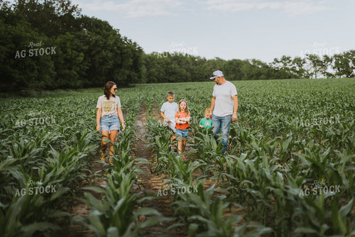 Farm Family Checking Corn 8732