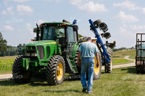 Farmer Walking to Tractor 52960