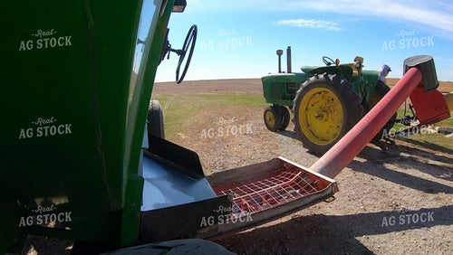 Female Farmer Turning off Sweep Auger 161146