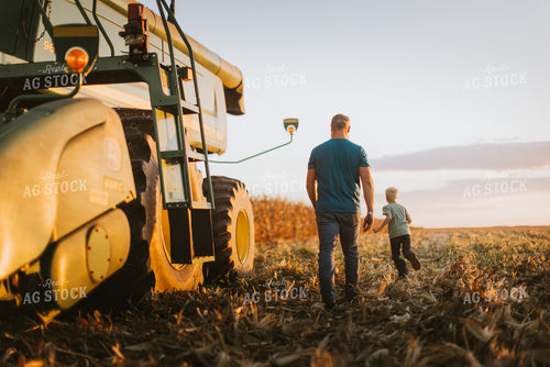 Farmer and Son Getting into Combine 9388