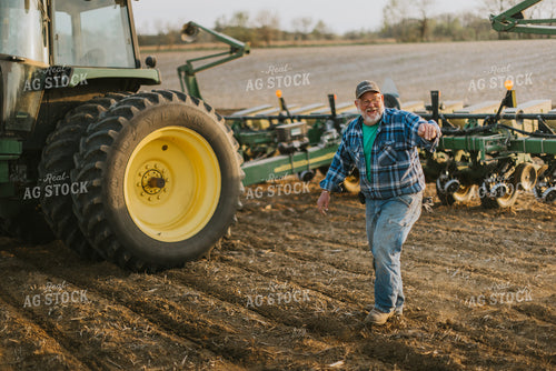 Farmer Walking Away From Planter 7454