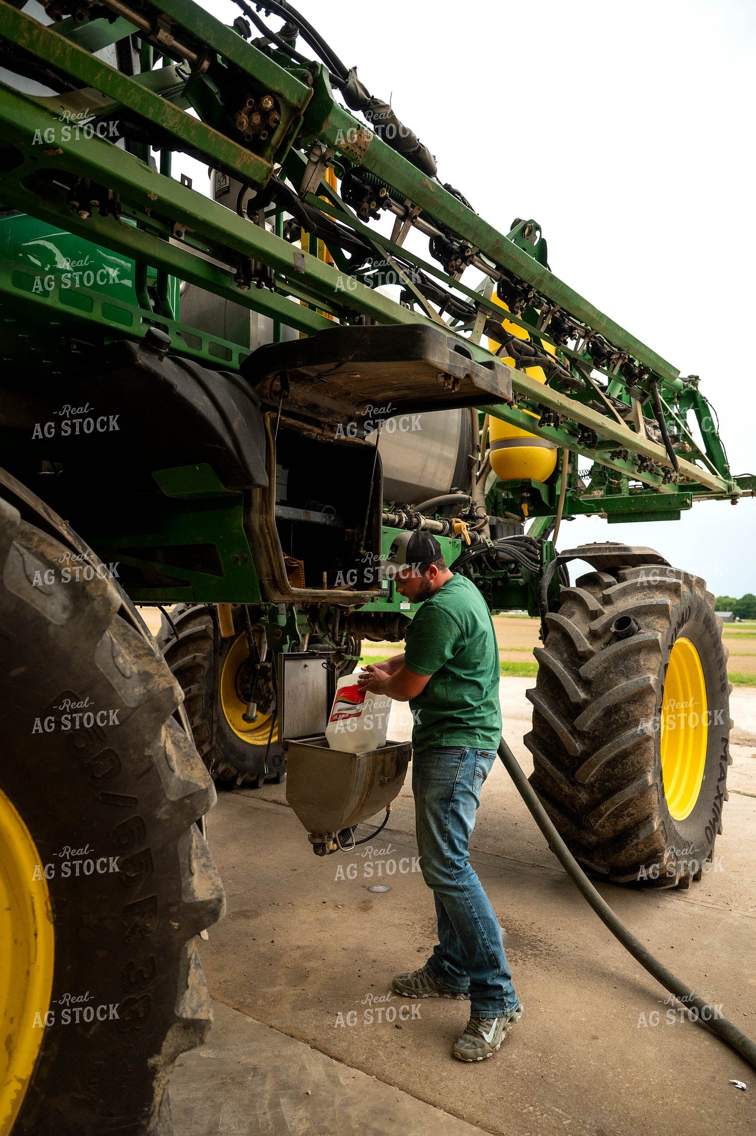 Farmer Filling Self-Propelled Sprayer 115742