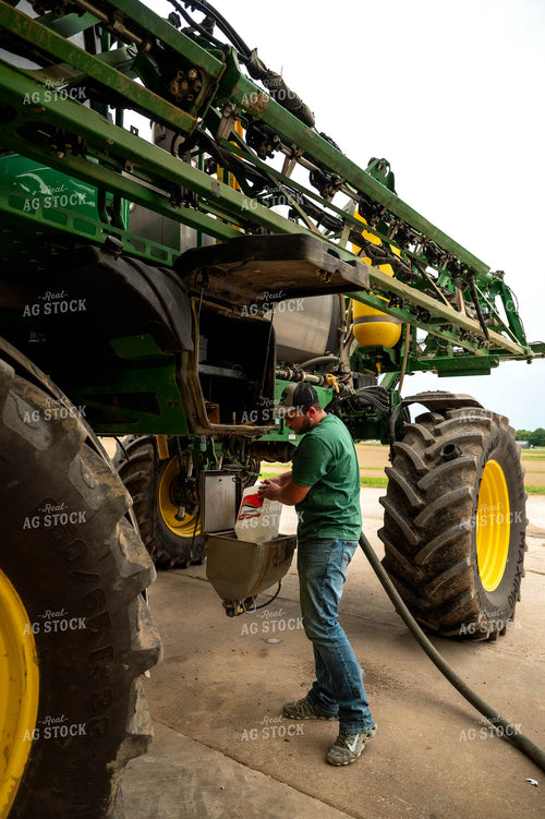 Farmer Filling Self-Propelled Sprayer 115742