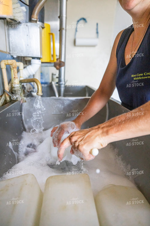 Farmer Washing Calf Bottles 270551