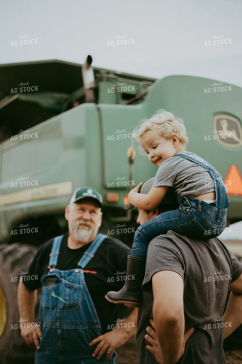 Farm Kid on Farmers Shoulders 111003