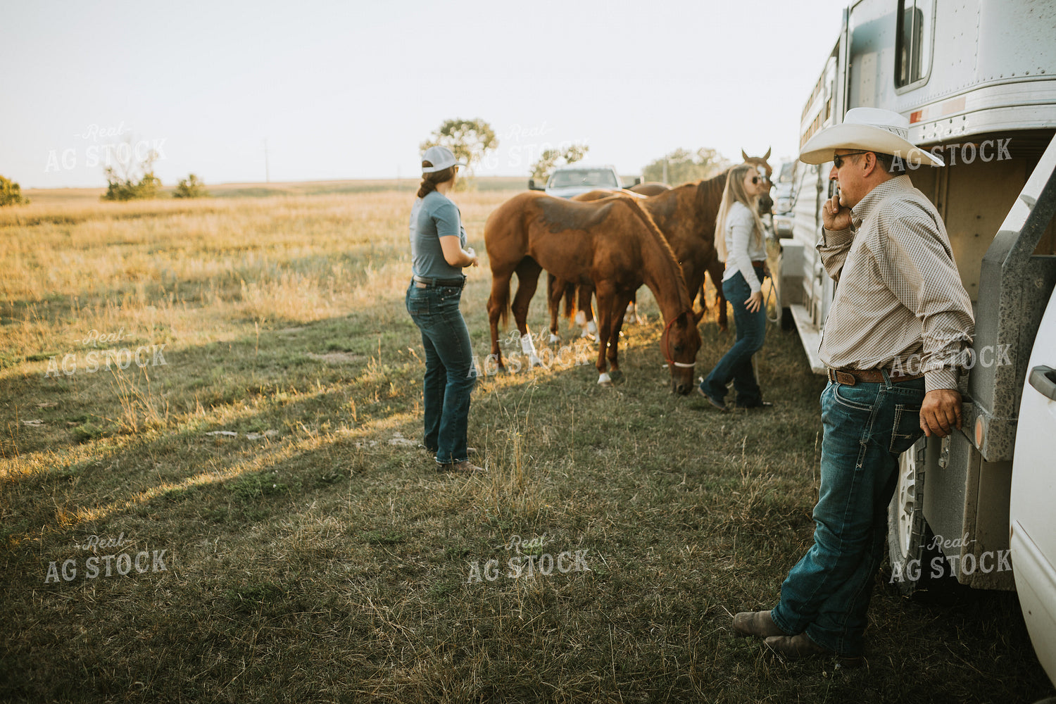Ranchers and Horses Near Livestock Trailer 6426