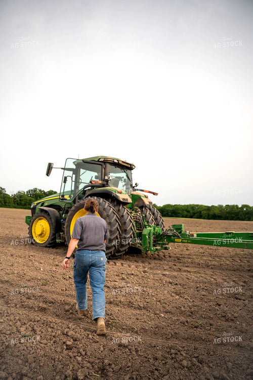 Female Farmer Walking by Planter 115660