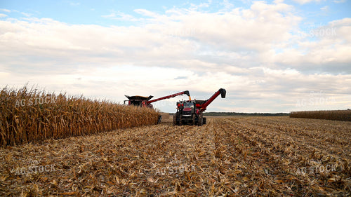 Combine Unloading Corn into Auger Wagon on the Go 25642
