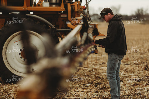 Farmer Checking Sprayer Valves 3644