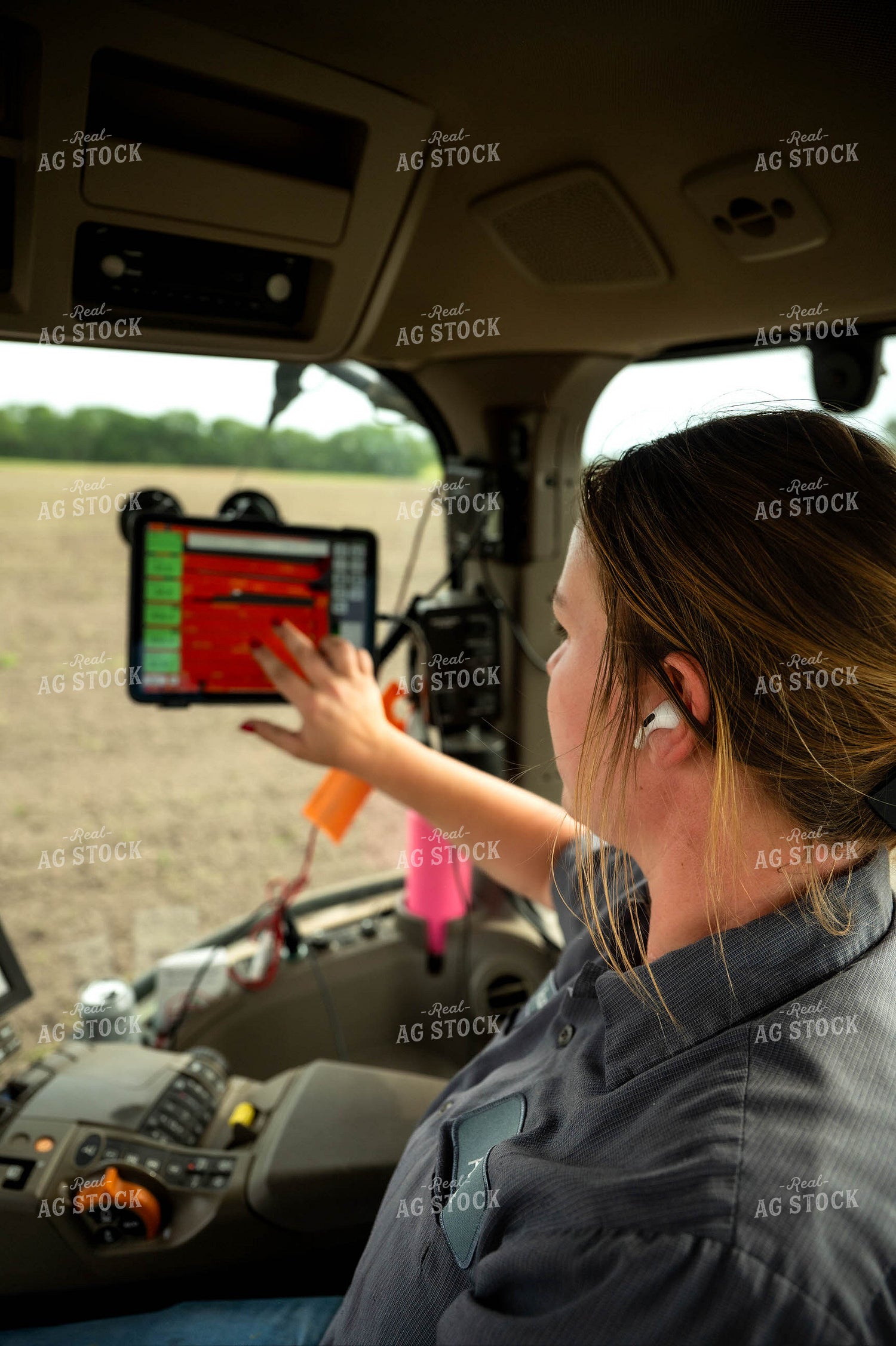 Female Farmer in Tractor Cab 115666