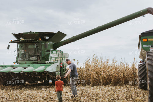 Farmer and Son Walking to Combine 8592
