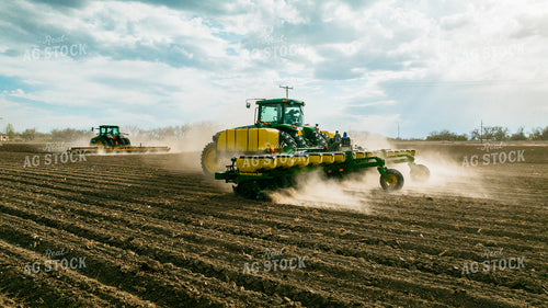 Tractor Rolls Field Ahead of Tractor Planting 56620
