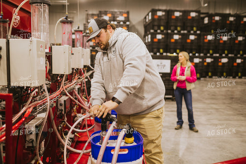Man Hooking Up Seed Treatment Chemical 5328