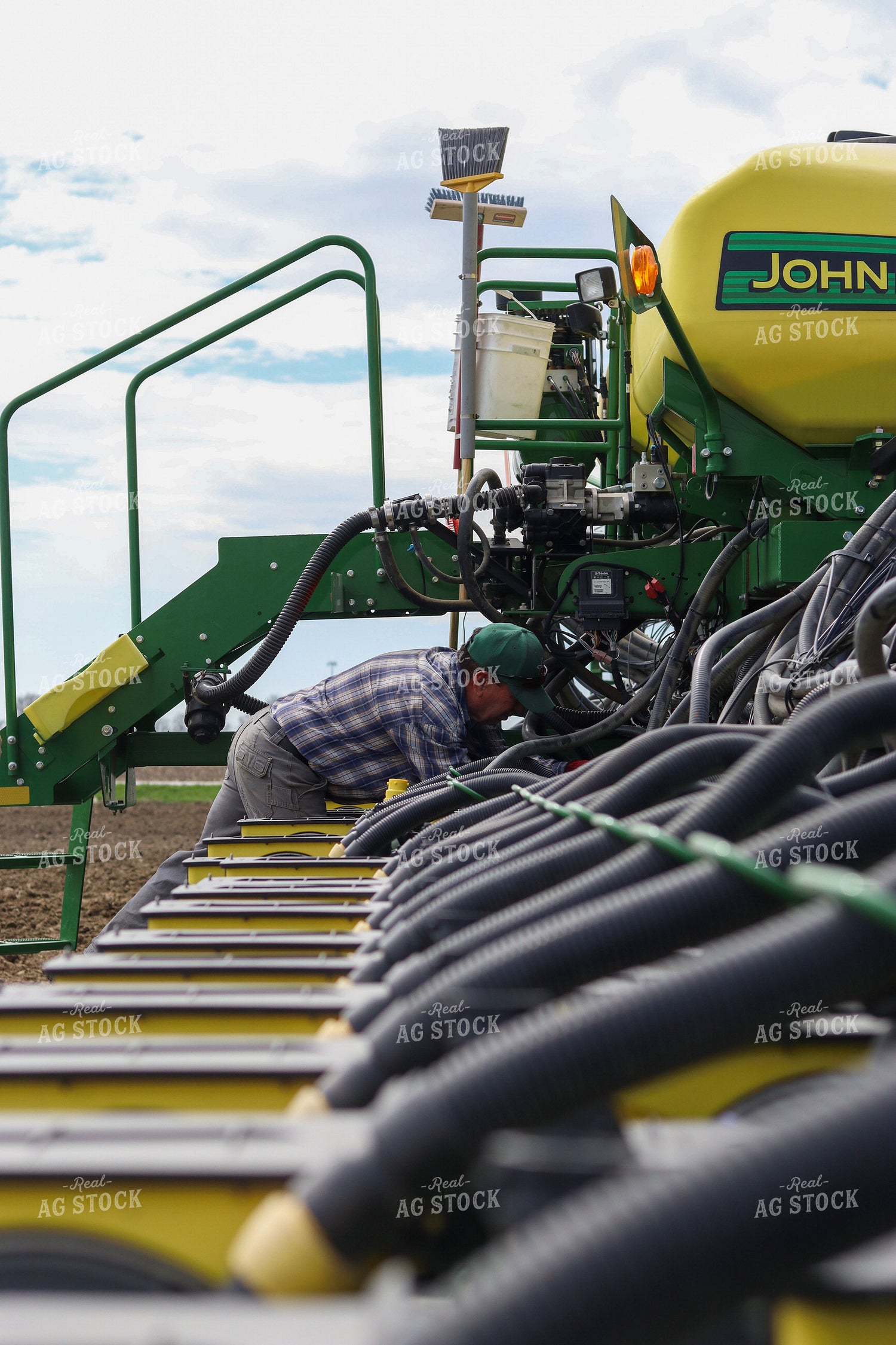 Farmer Working on Planter 109072
