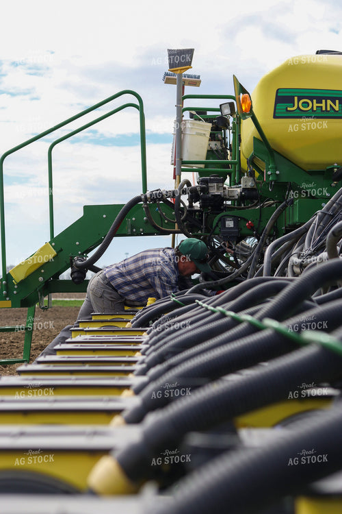 Farmer Working on Planter 109072