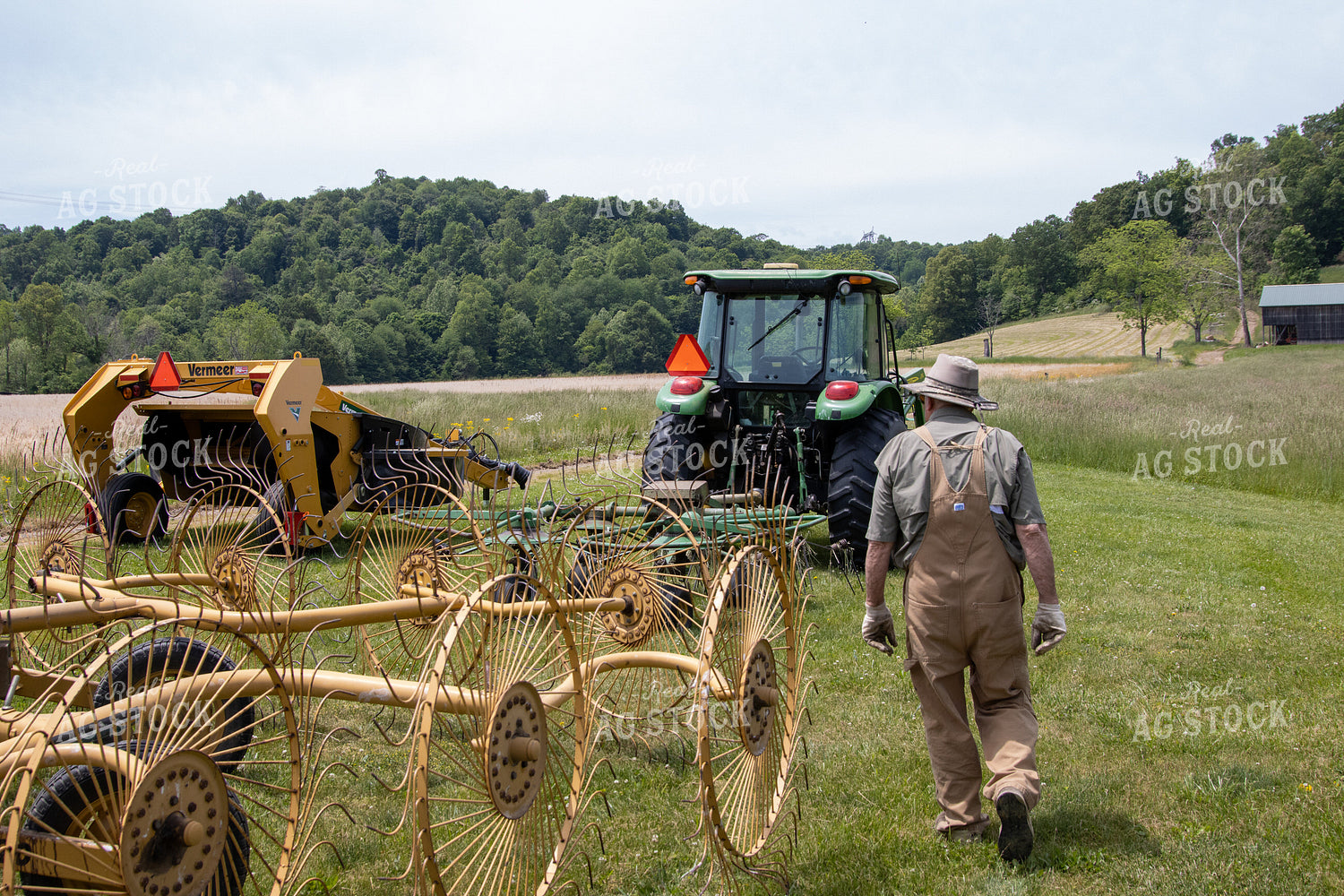 Farmer on Tractor with Hay Rake 52158