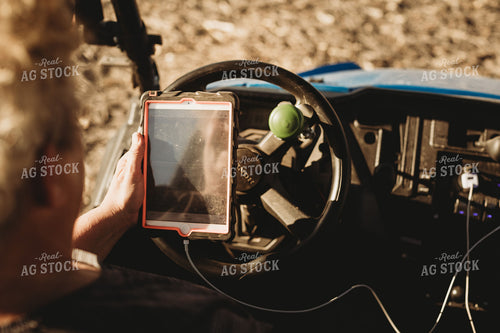 Farmer in Side by Side UTV with iPad 3727