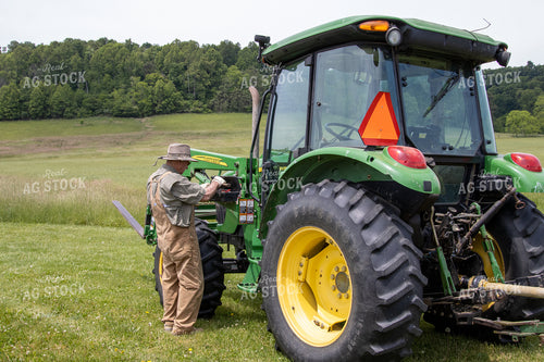 Farmer on Tractor with Hay Rake 52159
