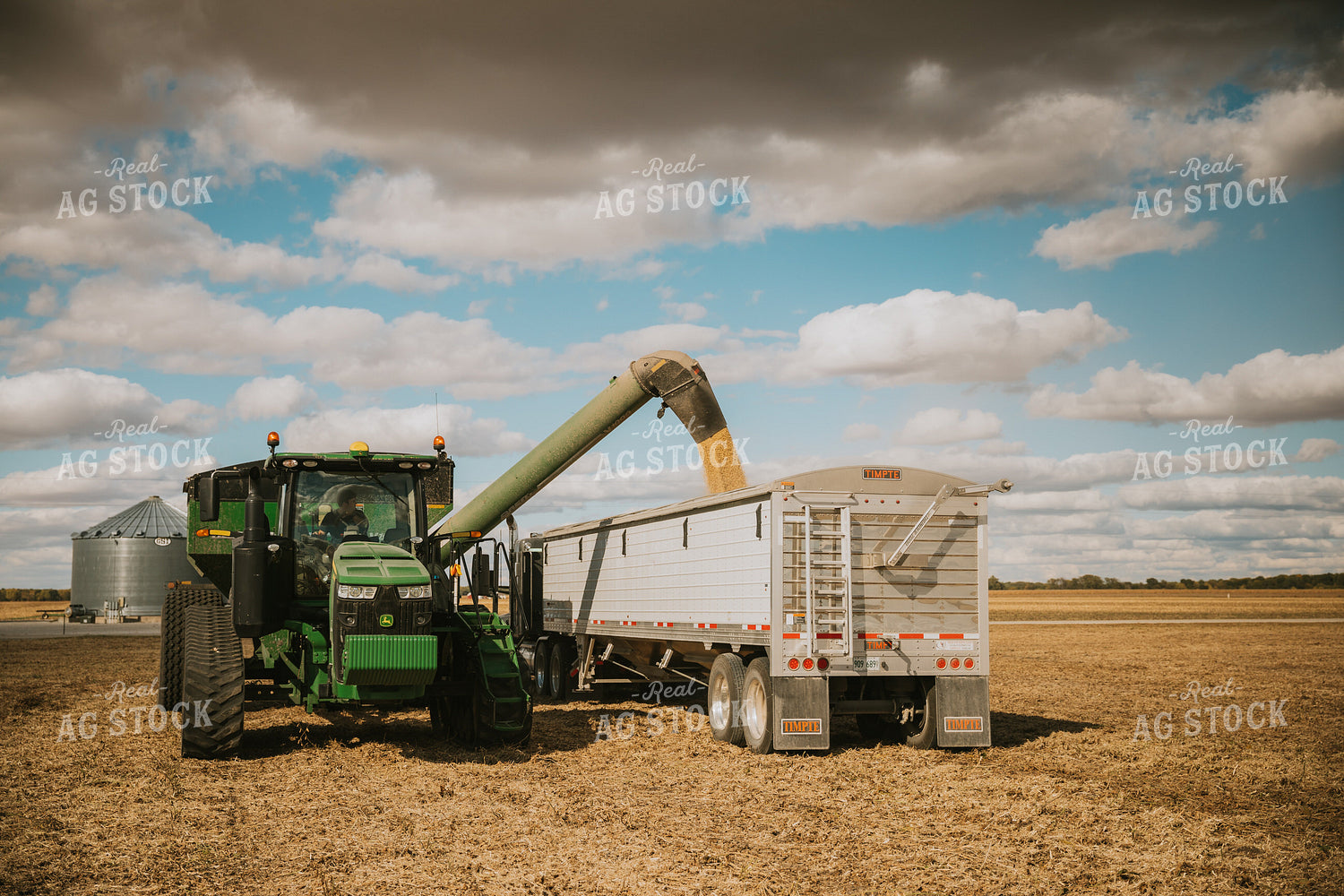 Grain Cart Unloading Soybeans into Semi 6891