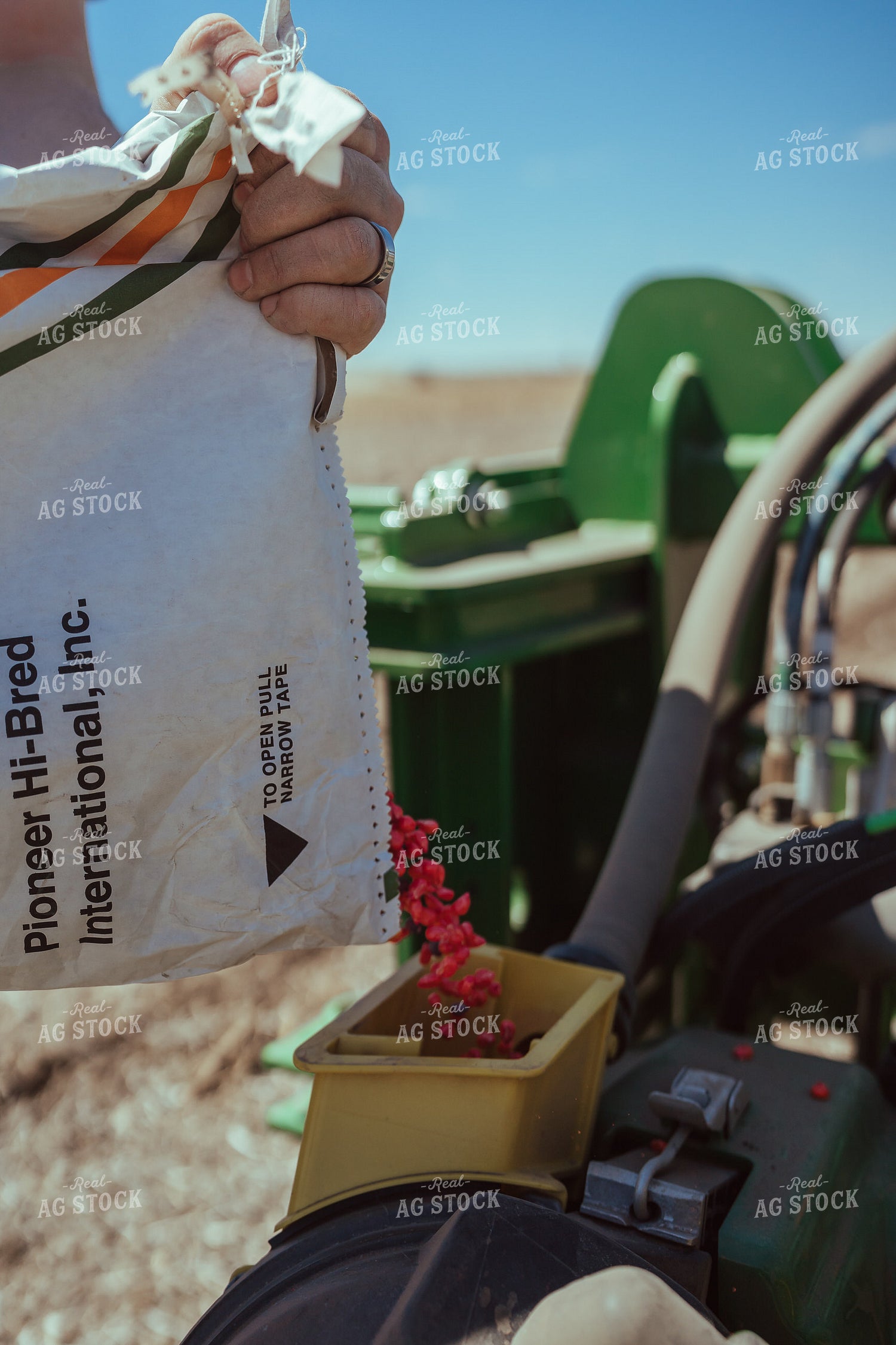 Farmer Filling Planter for Test Plot 196107