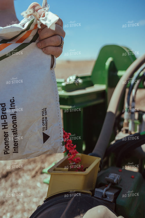 Farmer Filling Planter for Test Plot 196107