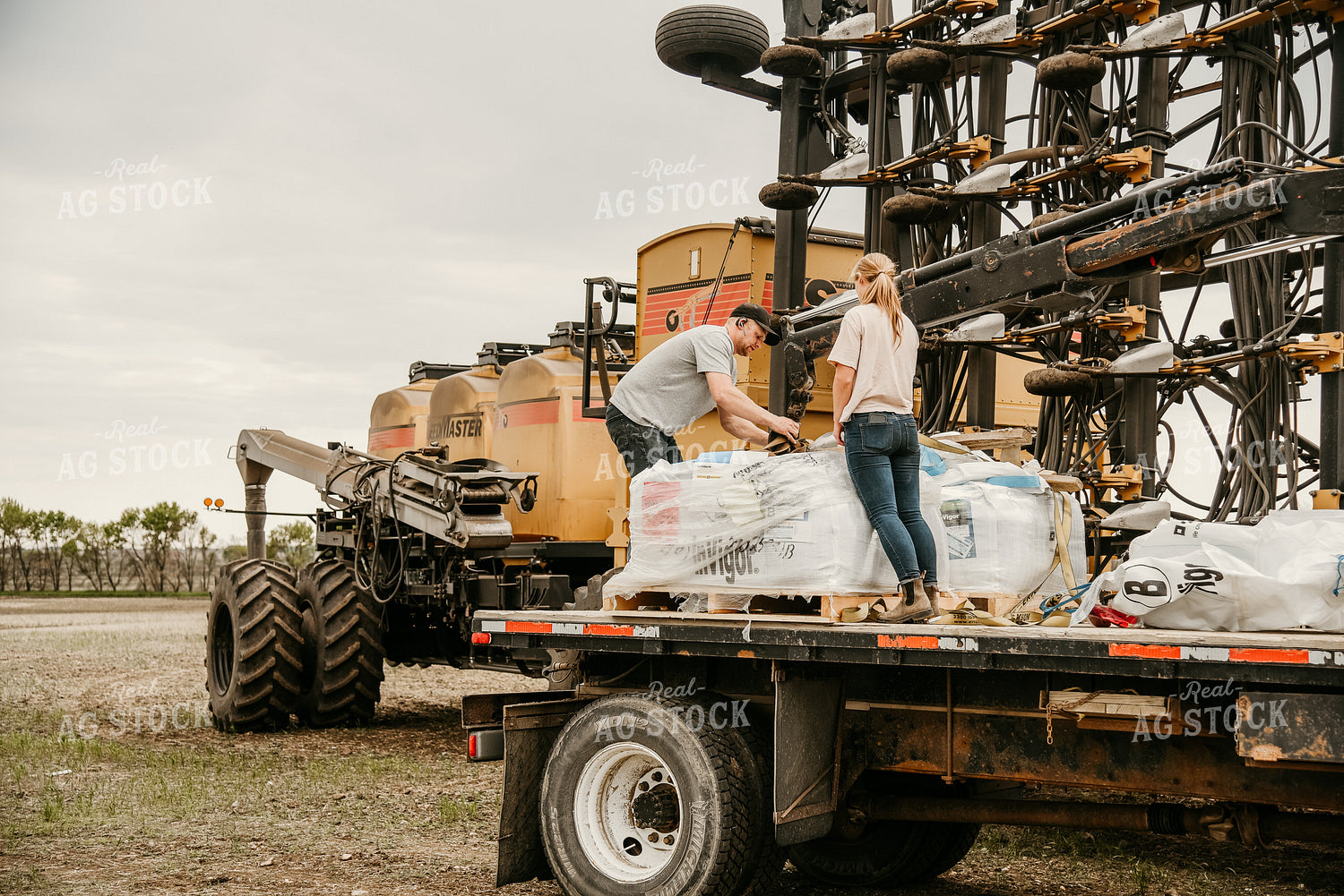 Farmers Loading Air Seeder 64270