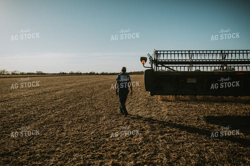 Farmer Walking Through Field 7120
