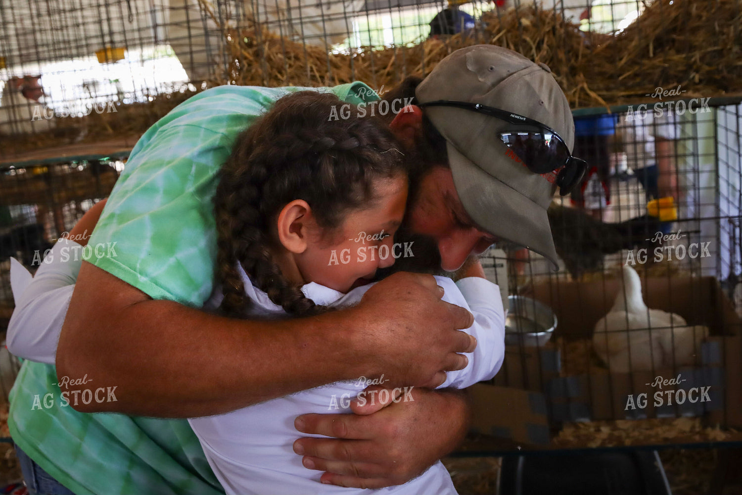 Father Daughter Hug in Poultry Barn 52172