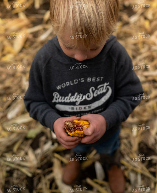 Farm Kid Holding Ear of Corn 185083