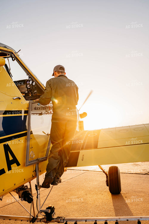 Applicator Climbing into Crop Duster 218012