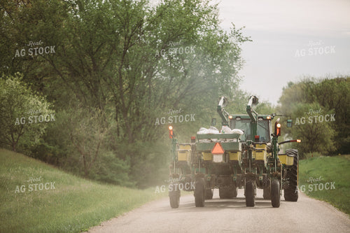 Tractor and Planter Driving Down Road 4011