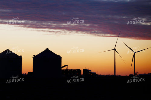 Silhouette of Truck Loading Grain from Bins at Sunset 129110