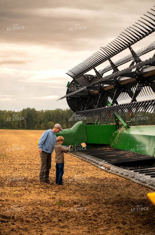 Farmer and Son Fixing Combine Head 115402