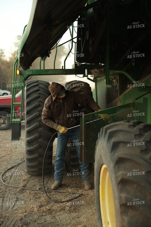 Farmer Blowing out Combine 114095