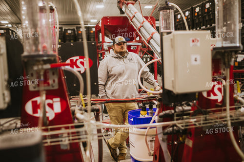 Man Monitoring Seed Treatment Chemical 5330
