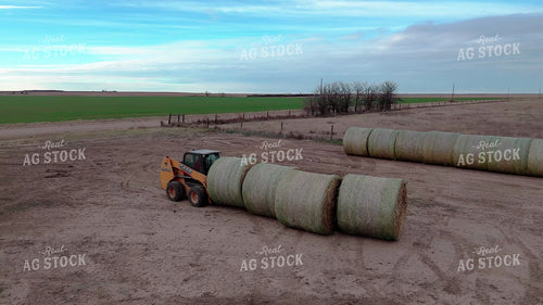 Aerial of Moving Round Bales 239545