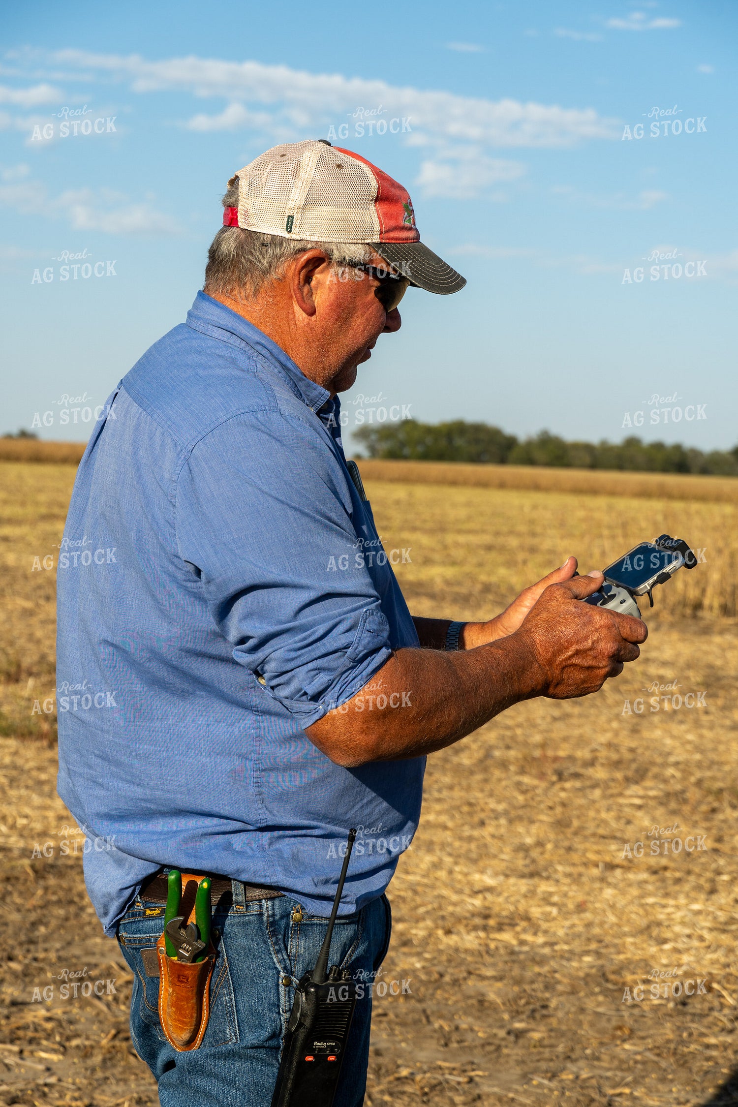 Farmer Flying Drone in Field 65086