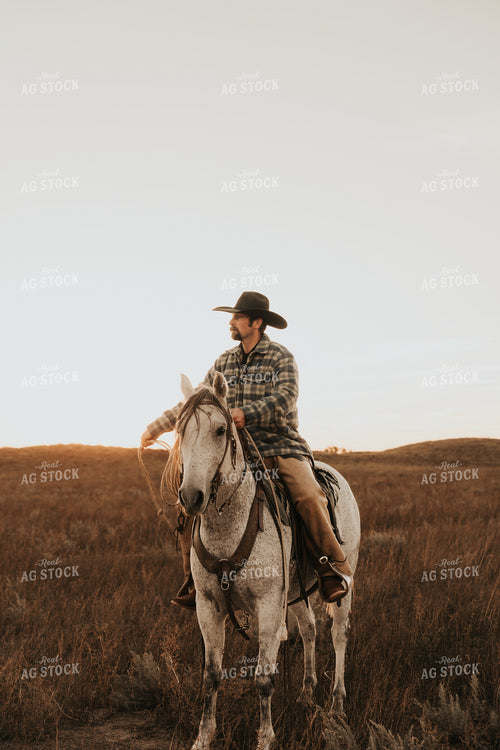Cowboy Riding Horse 61209
