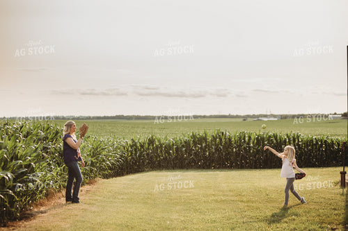 Farm Family Playing Catch Alongside Corn Field 4487