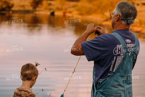 Farmer and Farm Kid Working on Fishing Pole 108048