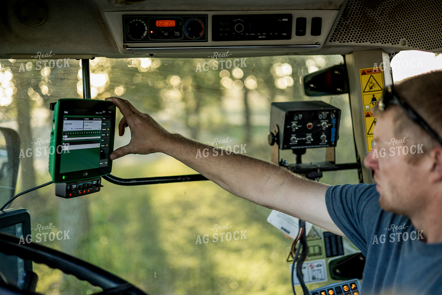 Farmer Setting Up Monitor 93342